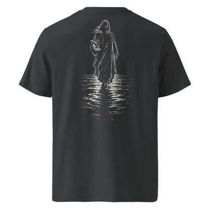 A dark charcoal gray short-sleeve t-shirt shown from the back, featuring a detailed white graphic of a hooded figure walking through water with ripples.